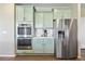 Well-equipped kitchen with stainless steel refrigerator, double oven, and plenty of cabinet space at 20855 Park Hollow Dr, Parker, CO 80138