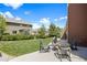Inviting patio area with a fire pit, seating, and well-maintained lawn, perfect for outdoor entertaining at 20855 Park Hollow Dr, Parker, CO 80138