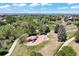 Scenic aerial view of a neighborhood park with a playground, walking paths, and lush green trees at 20855 Park Hollow Dr, Parker, CO 80138