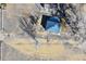 Overhead view of home with blue roof, showcasing yard size and rural surroundings in a quiet setting at 724 County Road 37, Brighton, CO 80603