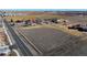 Property aerial view showing the lot size, road access, surrounding area, and distance to neighbors at 724 County Road 37, Brighton, CO 80603