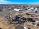 Quaint home with a large lot near town, plus mature trees and RV parking, all under a blue sky at 724 County Road 37, Brighton, CO 80603