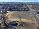 Overhead view showcasing the home's location relative to surrounding neighborhood and its proximity to roads at 724 County Road 37, Brighton, CO 80603