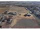 Aerial view showing the property outline and surrounding landscape at 724 County Road 37, Brighton, CO 80603
