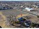 Expansive aerial view of the property showcasing its location and surrounding neighborhood, with trees near property at 724 County Road 37, Brighton, CO 80603