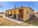 Charming home featuring stucco exterior and covered front patio with stone accents at 724 County Road 37, Brighton, CO 80603