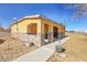 Charming home exterior featuring a welcoming covered porch with stone accents and a well-maintained landscape at 724 County Road 37, Brighton, CO 80603