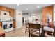 Eat-in kitchen has stainless steel appliances, granite countertops, and wood floors at 724 County Road 37, Brighton, CO 80603