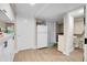 Functional kitchenette equipped with refrigerator and sink, located next to laundry at 724 County Road 37, Brighton, CO 80603