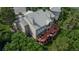 Aerial view of the expansive deck, patio, and lush greenery surrounding the home at 171 October Pl, Castle Rock, CO 80104