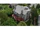 Aerial view showcasing the home's expansive deck, lush landscaping, and surrounding neighborhood at 171 October Pl, Castle Rock, CO 80104