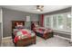 Bright bedroom showcasing two twin beds with wooden headboards and cozy patterned bedding at 171 October Pl, Castle Rock, CO 80104