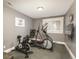 Well-lit exercise room equipped with elliptical and stationary bike at 171 October Pl, Castle Rock, CO 80104