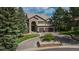 Beautiful two-story home with well-manicured landscaping, stone accents, and a spacious driveway at 171 October Pl, Castle Rock, CO 80104