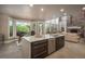Stylish kitchen with island, modern appliances, and open floor plan to the living room at 171 October Pl, Castle Rock, CO 80104