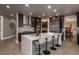 Bright kitchen with stainless appliances, dark cabinetry, and a large white island at 171 October Pl, Castle Rock, CO 80104