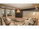 Comfortable living room featuring large sectional couch and modern gas fireplace at 171 October Pl, Castle Rock, CO 80104