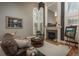 Cozy living room featuring a fireplace, stylish decor, and comfortable seating at 171 October Pl, Castle Rock, CO 80104
