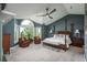 Serene bedroom boasts vaulted ceilings, a sitting area, and ample natural light at 171 October Pl, Castle Rock, CO 80104