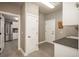 Clean mud room featuring grey tile flooring, white doors, and granite countertop at 171 October Pl, Castle Rock, CO 80104