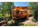 Charming home with a backyard deck that offers the perfect spot for relaxing and entertaining at 4805 S Blue Spruce Rd, Evergreen, CO 80439