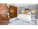 Bedroom with a gray accent wall, queen bed, and a mountain scene at 4805 S Blue Spruce Rd, Evergreen, CO 80439