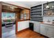 Charming butler's pantry leads to a cozy sunroom for seamless indoor-outdoor living at 4805 S Blue Spruce Rd, Evergreen, CO 80439