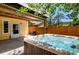 Relaxing backyard with a hot tub and outdoor seating, perfect for enjoying the beautiful surroundings at 4805 S Blue Spruce Rd, Evergreen, CO 80439