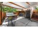 Backyard featuring a hot tub, outdoor seating area, shed and outdoor storage at 4805 S Blue Spruce Rd, Evergreen, CO 80439