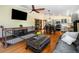 Open floor plan with hardwood floors connecting the living room, dining area, and kitchen at 4805 S Blue Spruce Rd, Evergreen, CO 80439