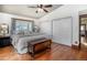Comfortable main bedroom boasts hardwood floors, closet space and a serene atmosphere at 4805 S Blue Spruce Rd, Evergreen, CO 80439