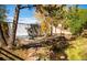 Beautiful water feature with a statue surrounded by trees and a running stream at 4805 S Blue Spruce Rd, Evergreen, CO 80439