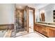Beautiful bathroom featuring a glass shower, soaking tub, granite counters, and wood accents at 805 Highfield Trl, Breckenridge, CO 80424