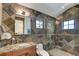 Lavish bathroom featuring beautiful stonework, updated vanity, and spacious walk-in shower at 805 Highfield Trl, Breckenridge, CO 80424