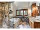 Relaxing bathroom with separate soaking tub, walk-in shower and wood cabinets with granite counter tops at 805 Highfield Trl, Breckenridge, CO 80424