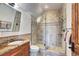 Bathroom featuring a glass shower, granite counter tops, wood cabinets and tile backsplash with a vanity at 805 Highfield Trl, Breckenridge, CO 80424