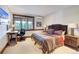 Comfortable bedroom with a wooden desk, beautiful natural light, and stylish decor at 805 Highfield Trl, Breckenridge, CO 80424
