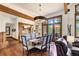 Elegant dining area with wood accents, large windows offering natural light and an outdoor view at 805 Highfield Trl, Breckenridge, CO 80424