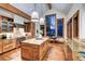 Well-appointed kitchen with central island, designer lighting and mountain views from the oversized picture window at 805 Highfield Trl, Breckenridge, CO 80424