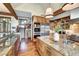 Gourmet kitchen boasting wood cabinets, stainless appliances, granite counters and an island with a sink at 805 Highfield Trl, Breckenridge, CO 80424