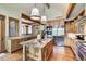 Bright kitchen features wood cabinets, stainless appliances, granite counters and an island with a sink at 805 Highfield Trl, Breckenridge, CO 80424