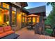 Beautiful outdoor deck featuring an umbrella, outdoor seating, and views through large windows at 805 Highfield Trl, Breckenridge, CO 80424