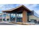 Commercial building with a grand entrance, expansive windows, and professional landscaping at 7960 Estes Ct, Arvada, CO 80005