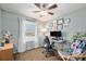 Inviting home office with large window, desk setup, and comfortable accent chair at 7960 Estes Ct, Arvada, CO 80005