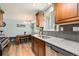 Spacious kitchen with wood cabinets, stainless steel appliances, granite countertops, and bright natural light for joyful cooking at 7960 Estes Ct, Arvada, CO 80005