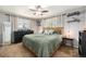 Serene main bedroom features soft lighting, neutral tones, and large windows, offering a comfortable and private retreat at 7960 Estes Ct, Arvada, CO 80005