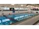 Indoor swimming pool with lane markers and scoreboard for recreational and competitive swimming at 7960 Estes Ct, Arvada, CO 80005