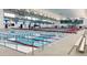 Spacious indoor pool area with lane dividers, bleachers, and excellent lighting for year-round use at 7960 Estes Ct, Arvada, CO 80005