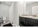 Functional bathroom with granite counter, tile flooring, and a shower with curtain at 2688 Loon Cir, Castle Rock, CO 80104