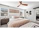 Bright bedroom with carpeted floor, ceiling fan and a large window at 2688 Loon Cir, Castle Rock, CO 80104
